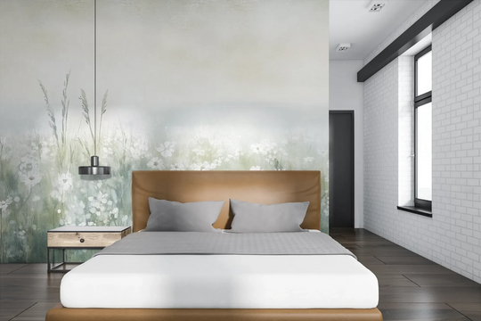 Wzór fototapety IVORY WILDFIELDS - tapeta z mglista łąką w delikatnych barwach pokazanej w aranżacji sypialni.