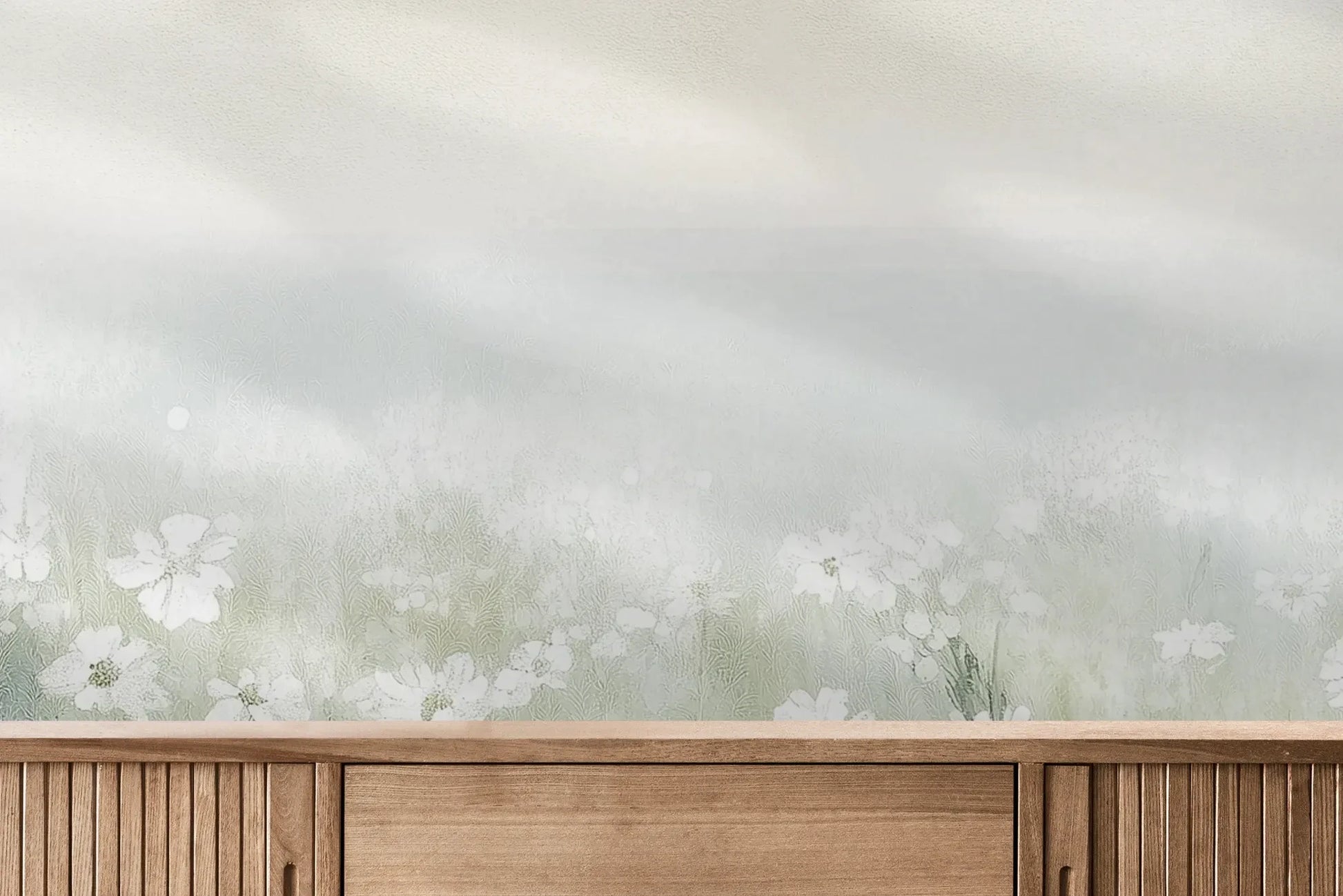 Fototapeta IVORY WILDFIELDS - tapeta z mglista łąką w delikatnych barwach pokazana w aranżacji wnętrza z akcentem na ścianie.
