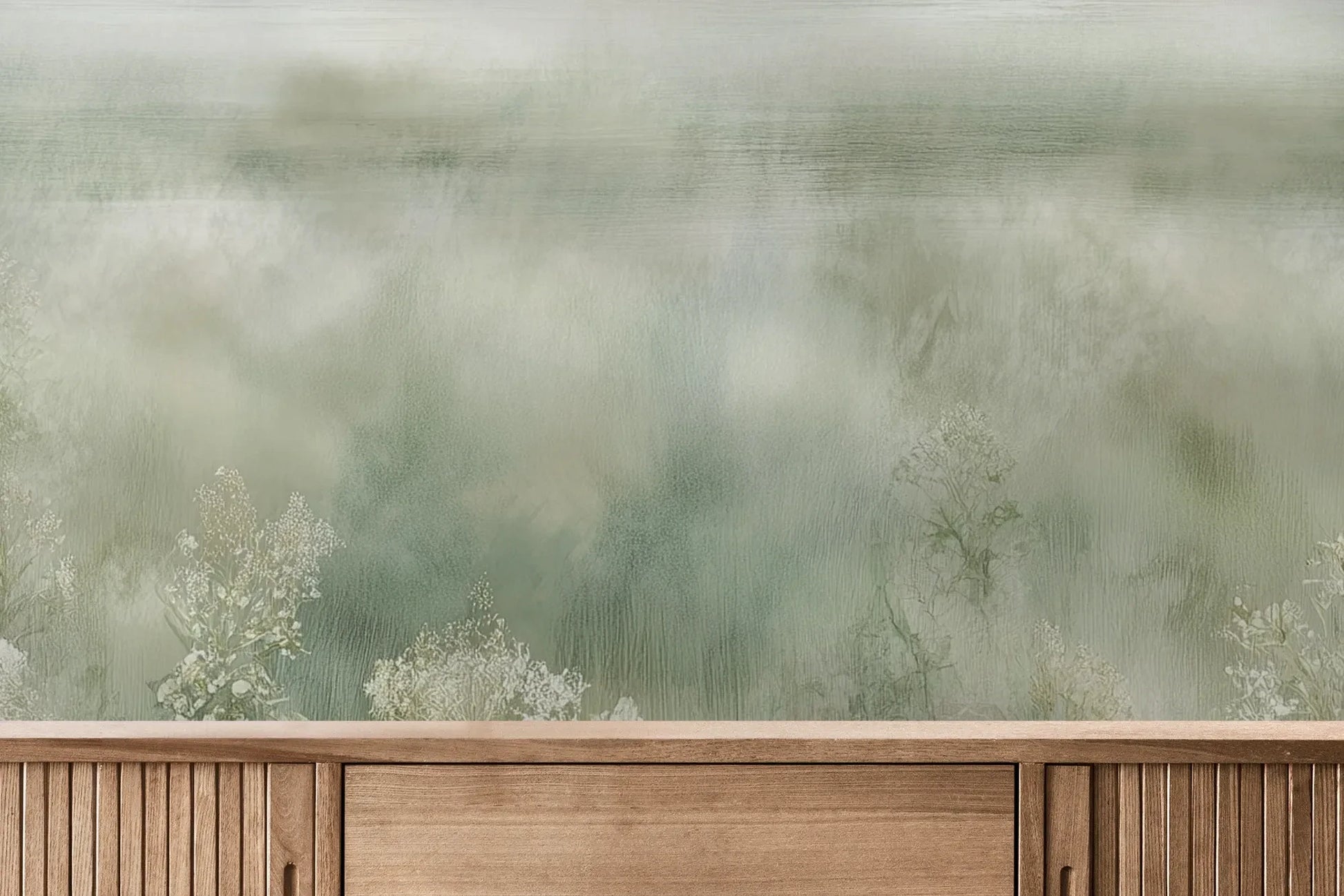 Fototapeta FROST BLOSSOM VISTA - tapeta z mglistą łąką kwiatów pokazana w aranżacji wnętrza z akcentem na ścianie.