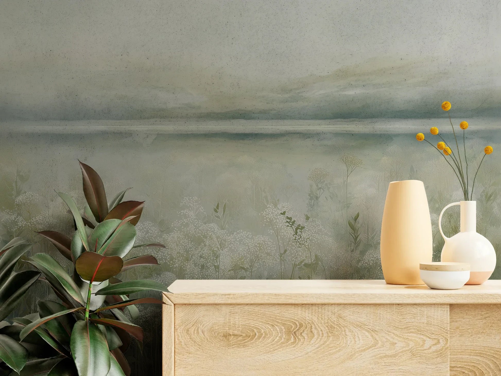 Fototapeta HORIZON REVERIE - tapeta z delikatną łąką w porannej mgle pokazana w aranżacji wnętrza z akcentem na ścianie.