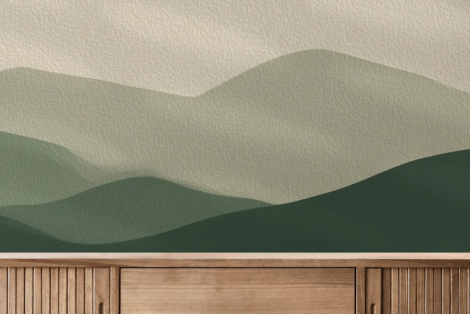 Fototapeta TERRACOTTA HIGHLANDS - tapeta z łąką i górami pokazana w aranżacji wnętrza z akcentem na ścianie.