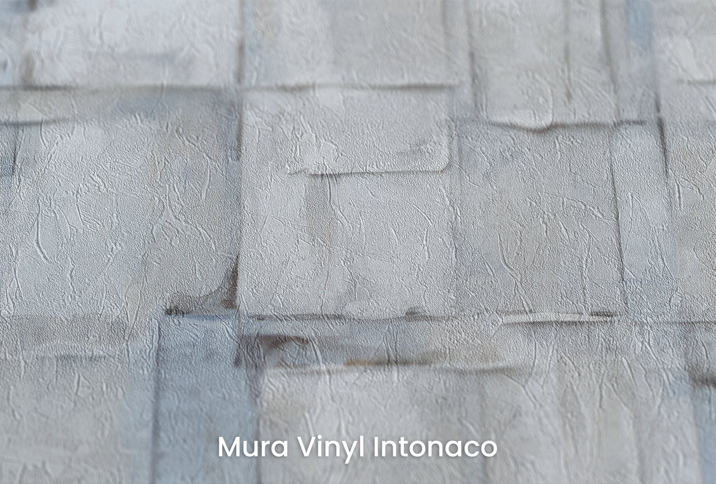 Zbliżenie na artystyczną fototapetę o nazwie Gentle Ice na podłożu Mura Vinyl Intonaco - struktura tartego tynku.