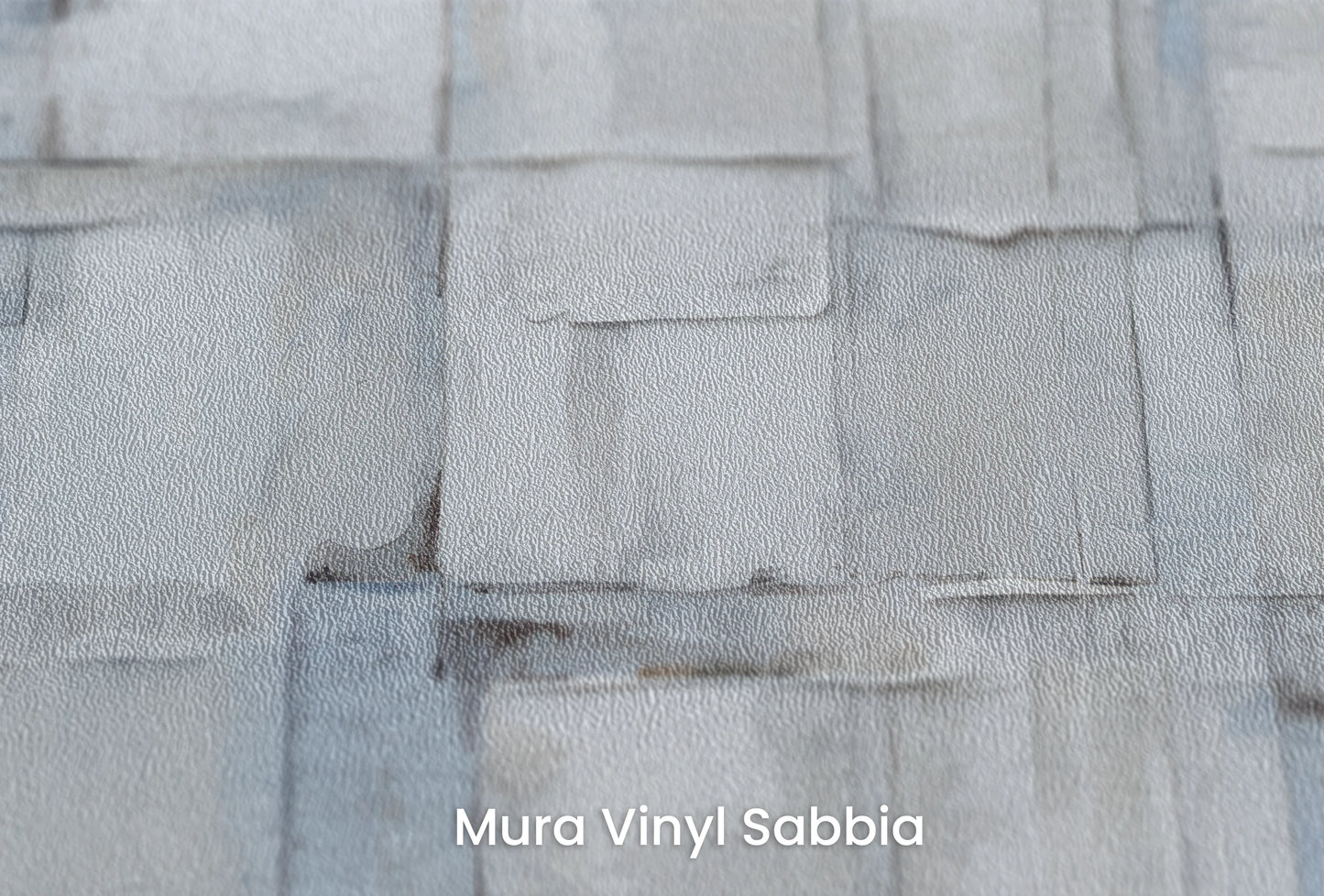 Zbliżenie na artystyczną fototapetę o nazwie Gentle Ice na podłożu Mura Vinyl Sabbia struktura grubego ziarna piasku.