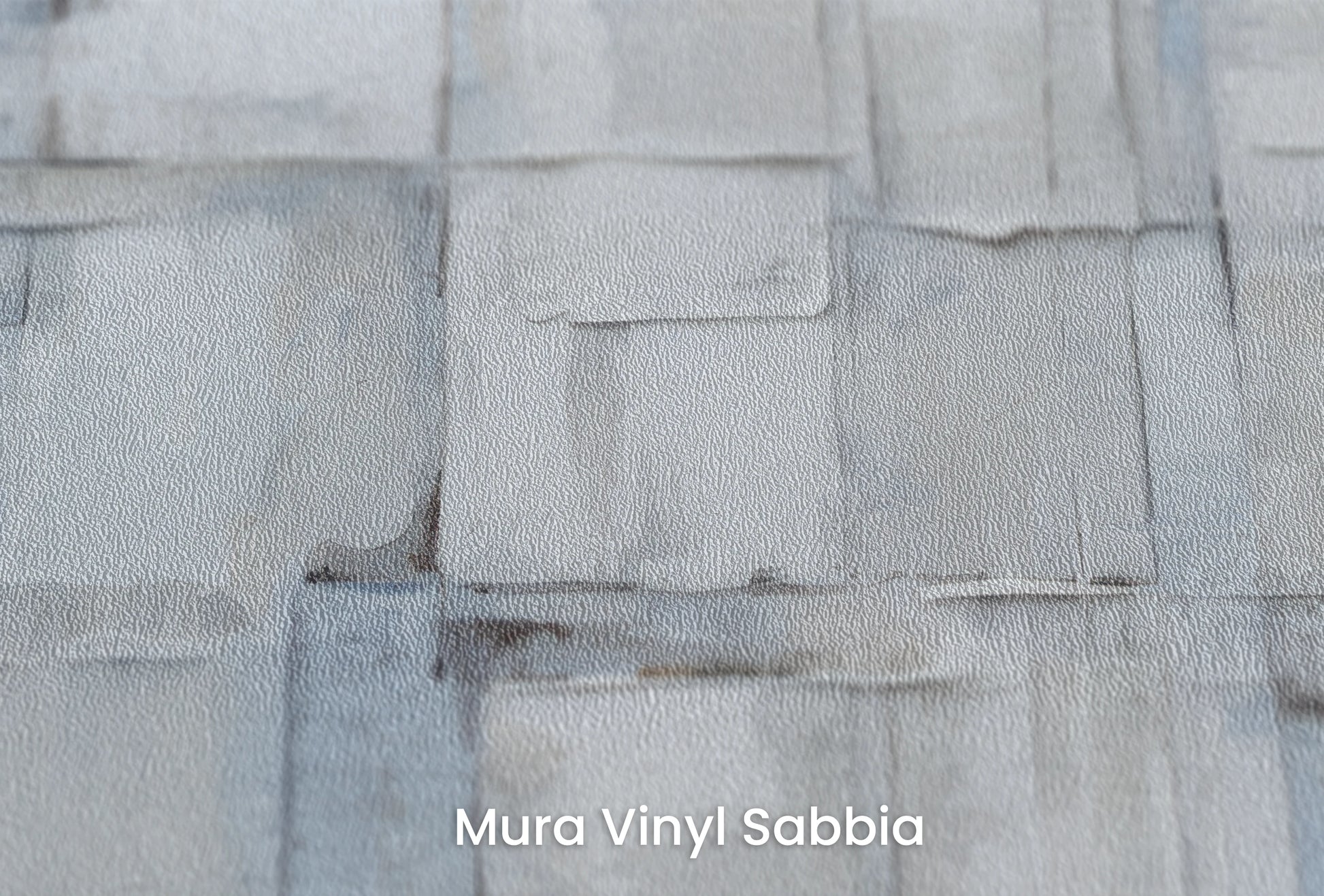 Zbliżenie na artystyczną fototapetę o nazwie Gentle Ice na podłożu Mura Vinyl Sabbia struktura grubego ziarna piasku.