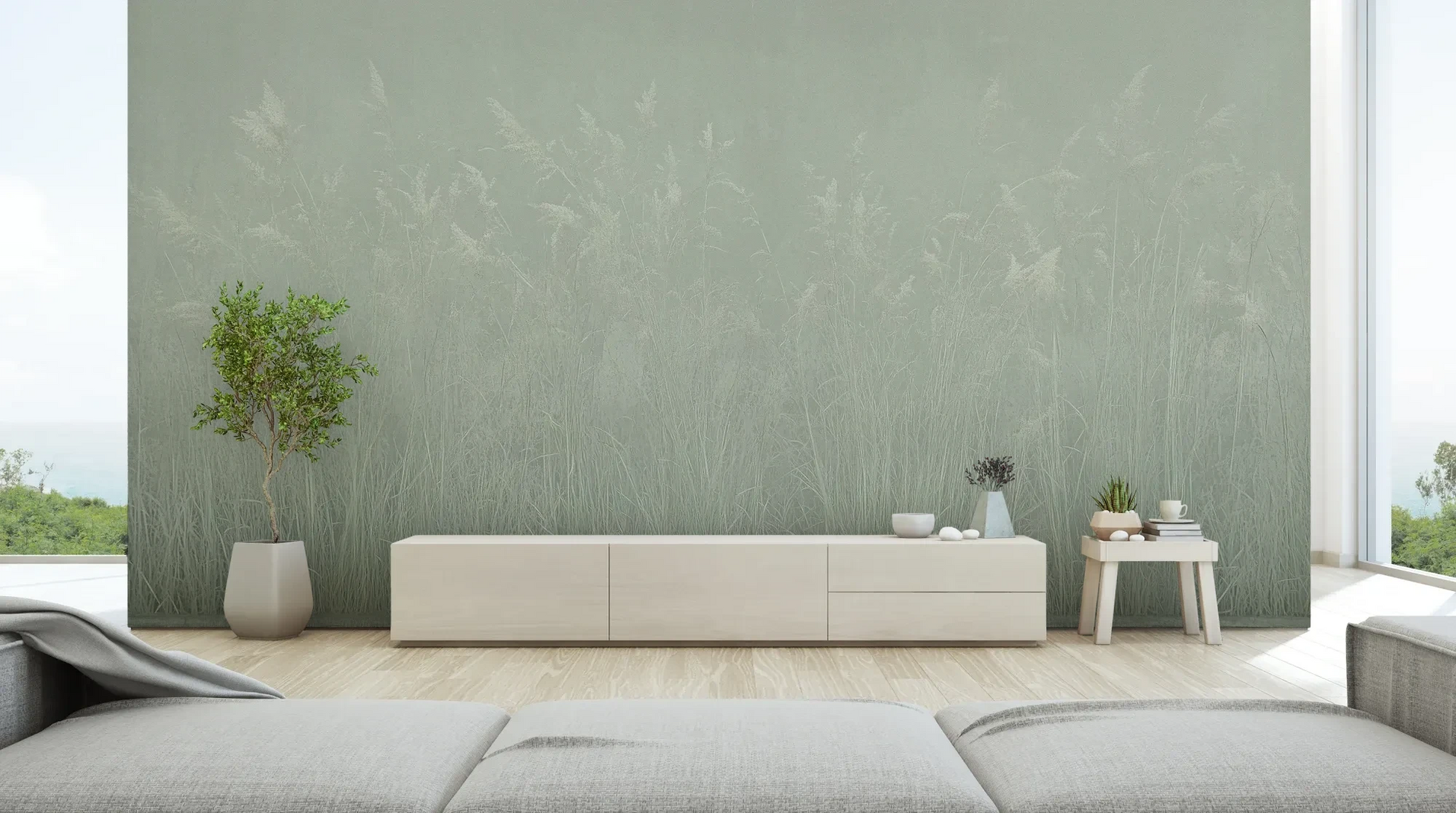 Wzór fototapety SILENT SHORE - tapeta z mglistą trawą w szarej tonacji pokazanej w aranżacji salonu.