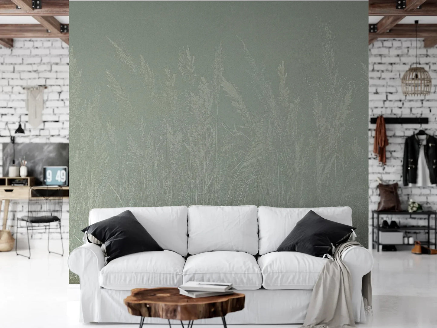 Wzór fototapety MEADOW REVERIE - tapeta z delikatnym wzorem traw na seledynowym tle pokazanej w aranżacji salonu.