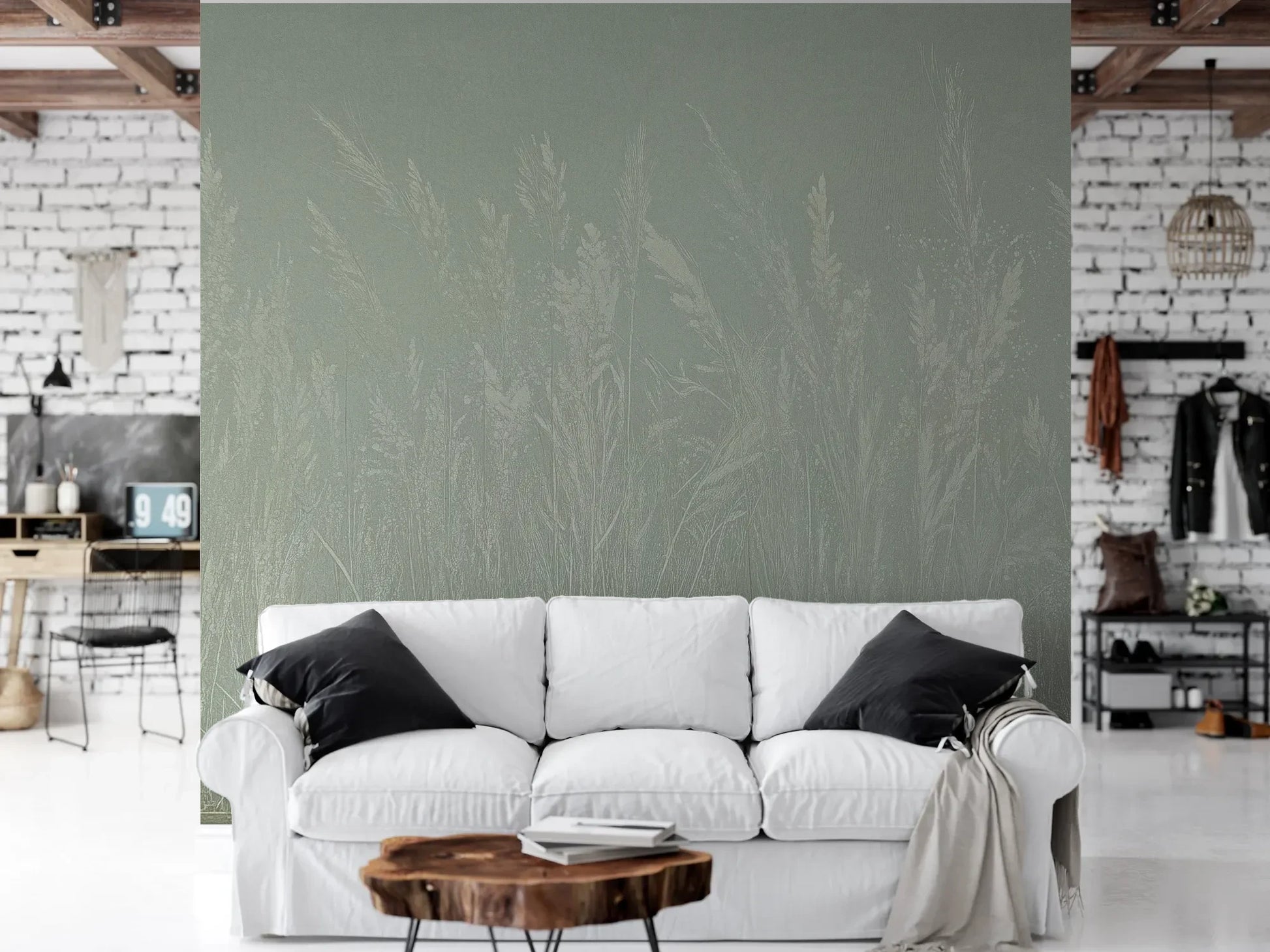 Wzór fototapety MEADOW REVERIE - tapeta z delikatnym wzorem traw na seledynowym tle pokazanej w aranżacji salonu.