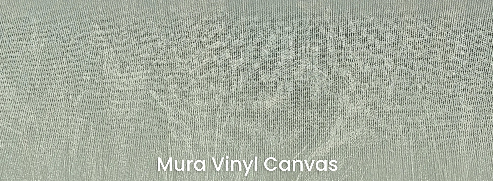 Zbliżenie na fototapetę MEADOW REVERIE - tapeta z delikatnym wzorem traw na seledynowym tle na podłożu o fakturze płótna.