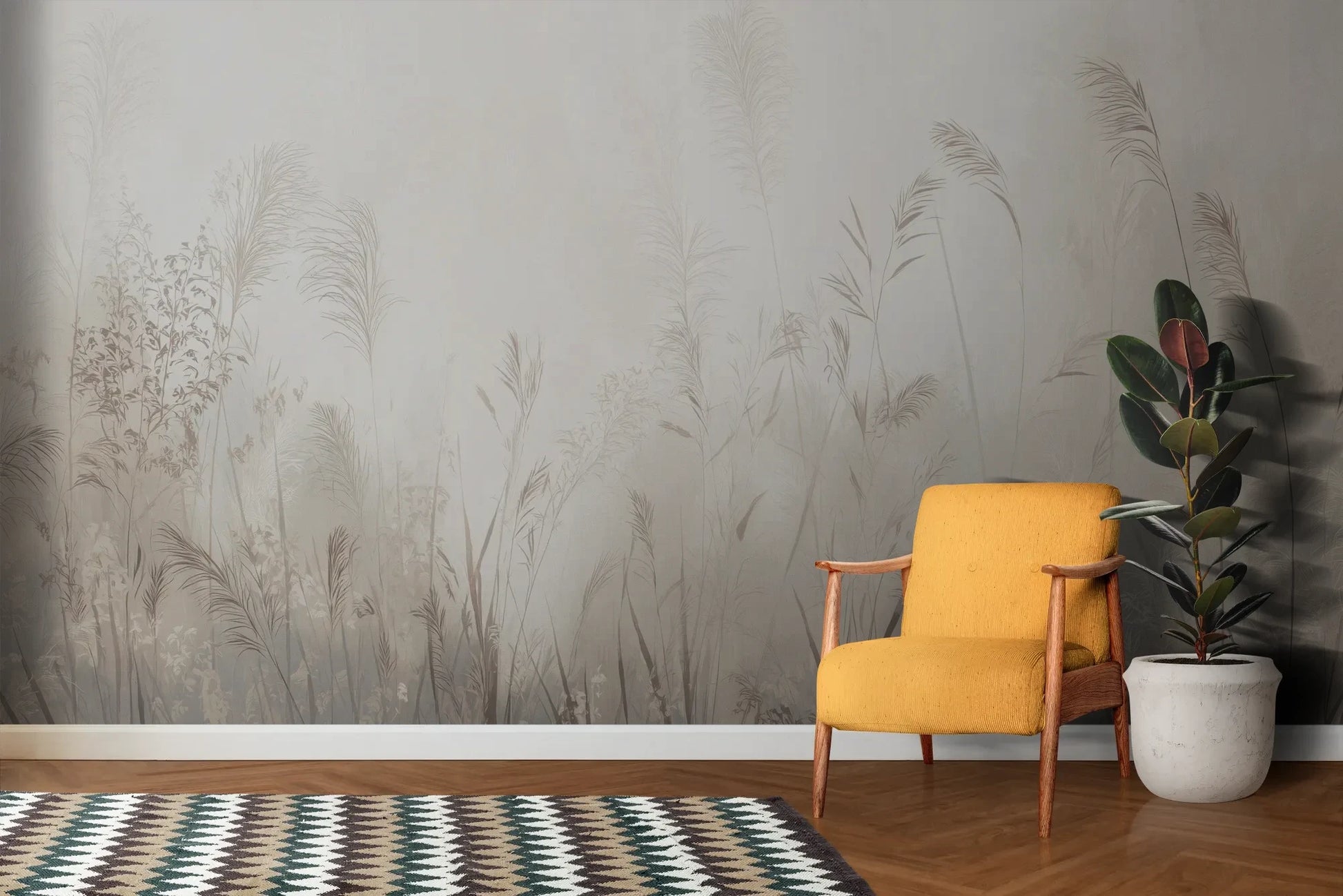 Wzór fototapety REED SYMPHONY - tapeta z mglistymi trawami w szarościach pokazanej w aranżacji salonu.