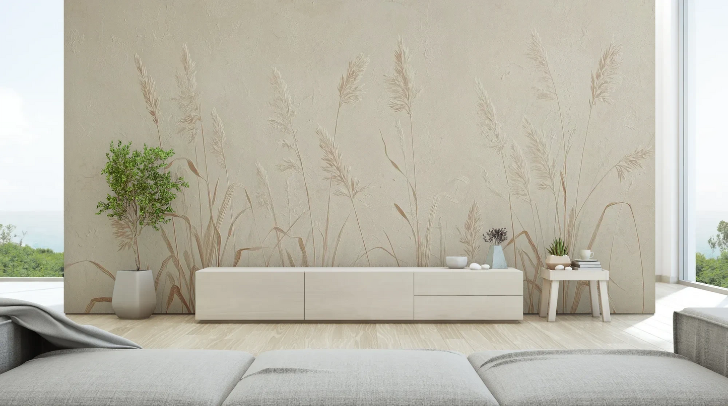 Wzór fototapety NATURE'S LULLABY - tapeta z delikatnymi źdźbłami traw w beżowej tonacji pokazanej w aranżacji salonu.