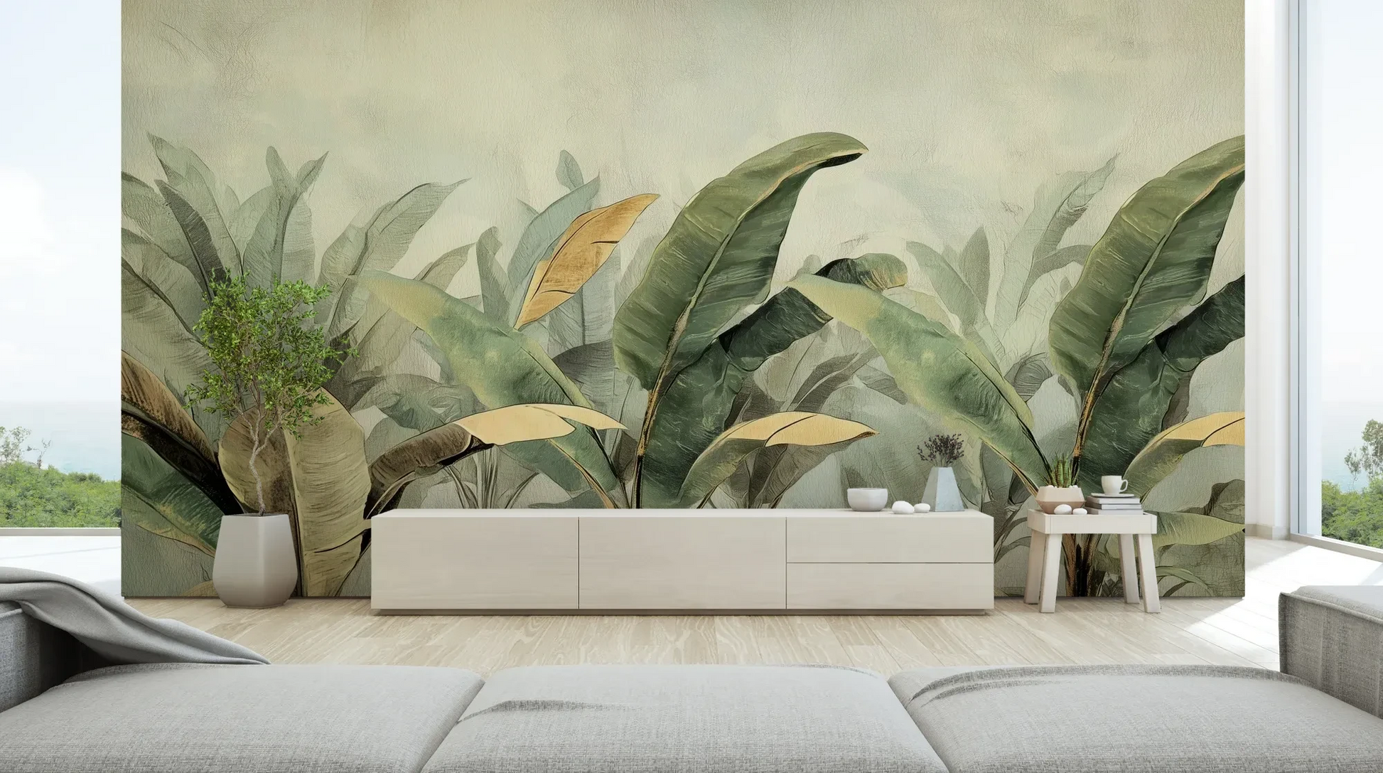 Wzór fototapety BANANA SERENITY - tapeta z tropikalnymi liśćmi bananowca w stonowanych odcieniach pokazanej w aranżacji salonu.