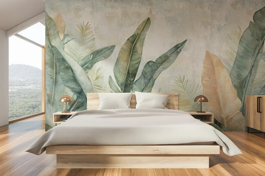 Wzór fototapety TROPIC WATERCOLORS - tapeta z egzotycznymi liśćmi w akwarelowej stylistyce pokazanej w aranżacji sypialni.