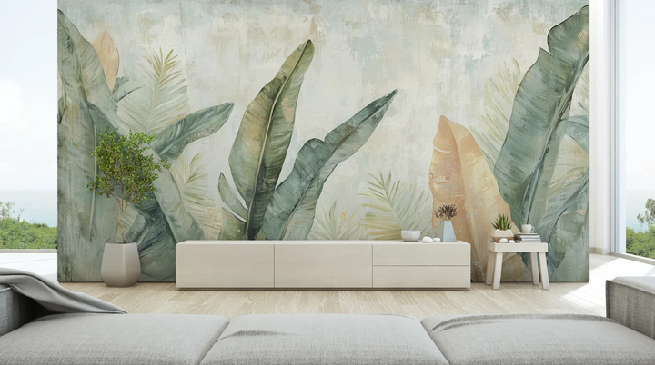 Wzór fototapety TROPIC WATERCOLORS - tapeta z egzotycznymi liśćmi w akwarelowej stylistyce pokazanej w aranżacji salonu.