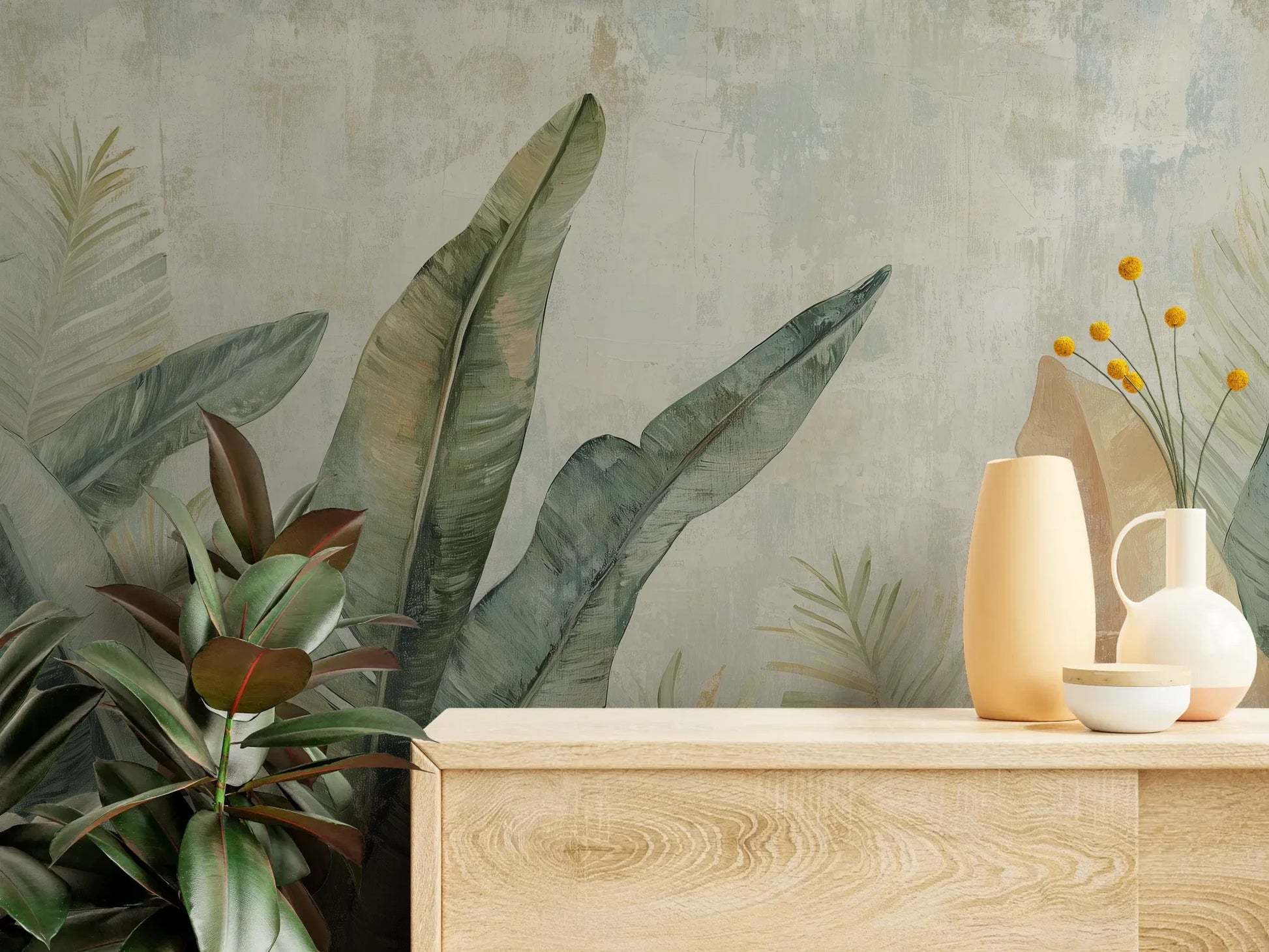 Fototapeta TROPIC WATERCOLORS - tapeta z egzotycznymi liśćmi w akwarelowej stylistyce pokazana w aranżacji wnętrza z akcentem na ścianie.
