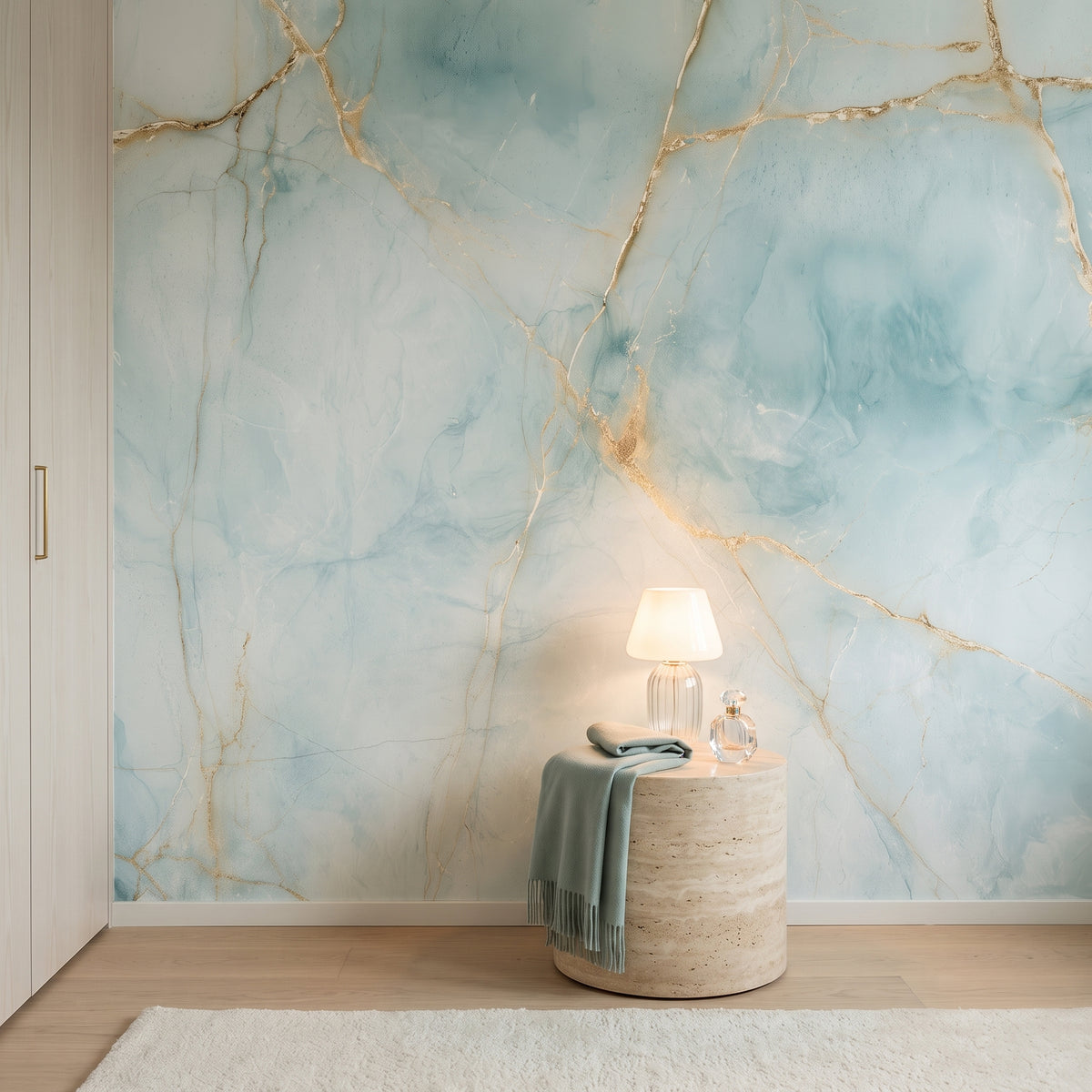 CELADON KINTSUGI in a dressing room setting, behind a round travertine table with a glass lamp
