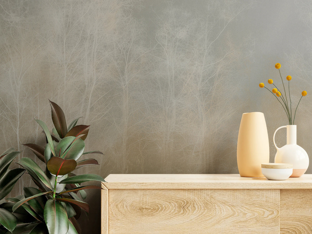 STILL GLADE en gros plan – fines branches blanches sur fond gris sable au-dessus d'une commode en bois clair