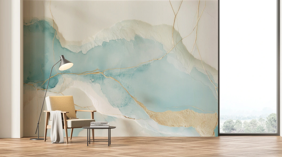 TORN WASHI across the whole wall of a light living room: a band of turquoise and gold lines above an armchair, a lamp and a table