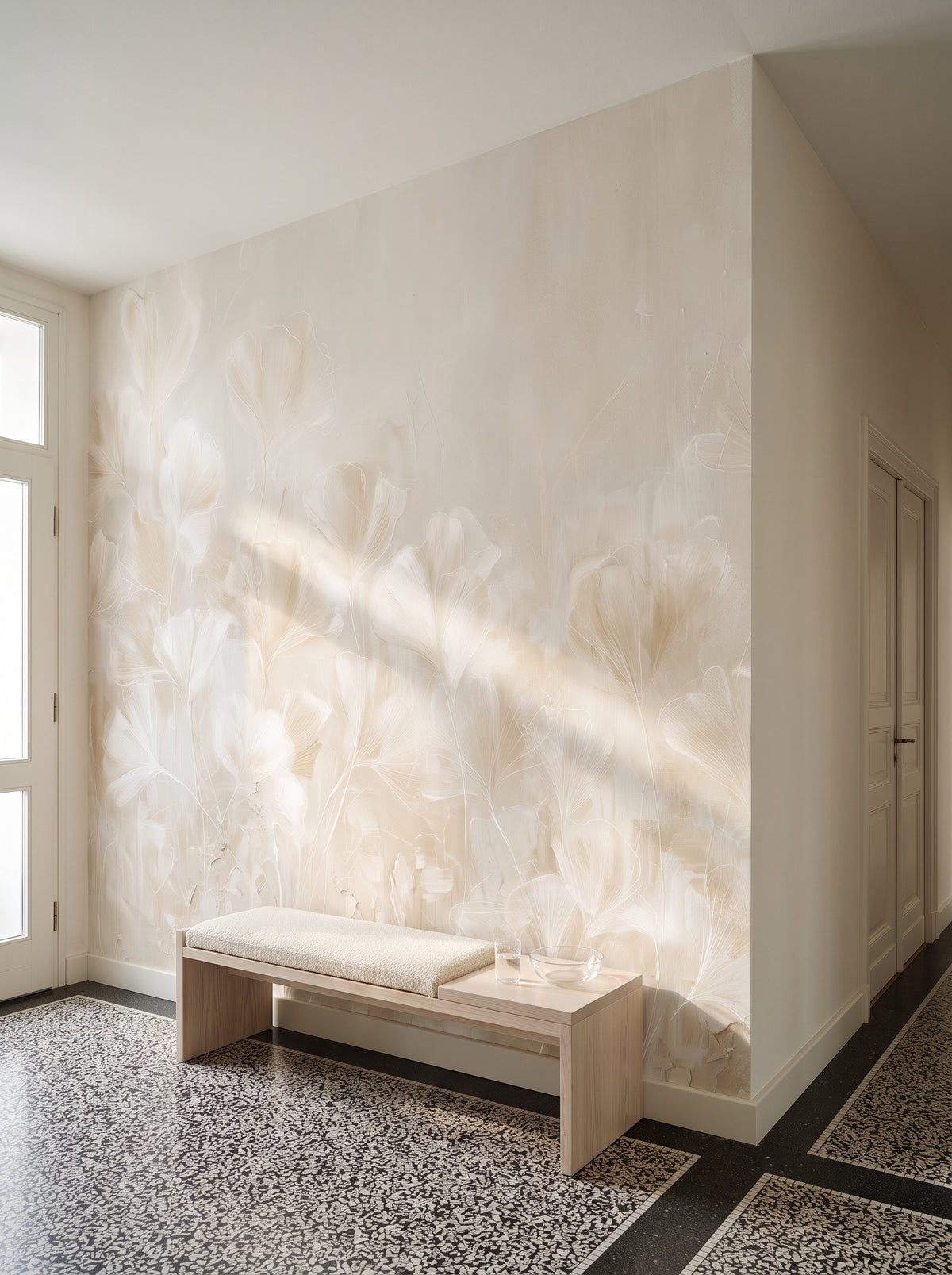 TRACERY in a hall setting in a Viennese Art Nouveau townhouse, with an ash bench with a wool seat, a glass and a bowl in front of the wall