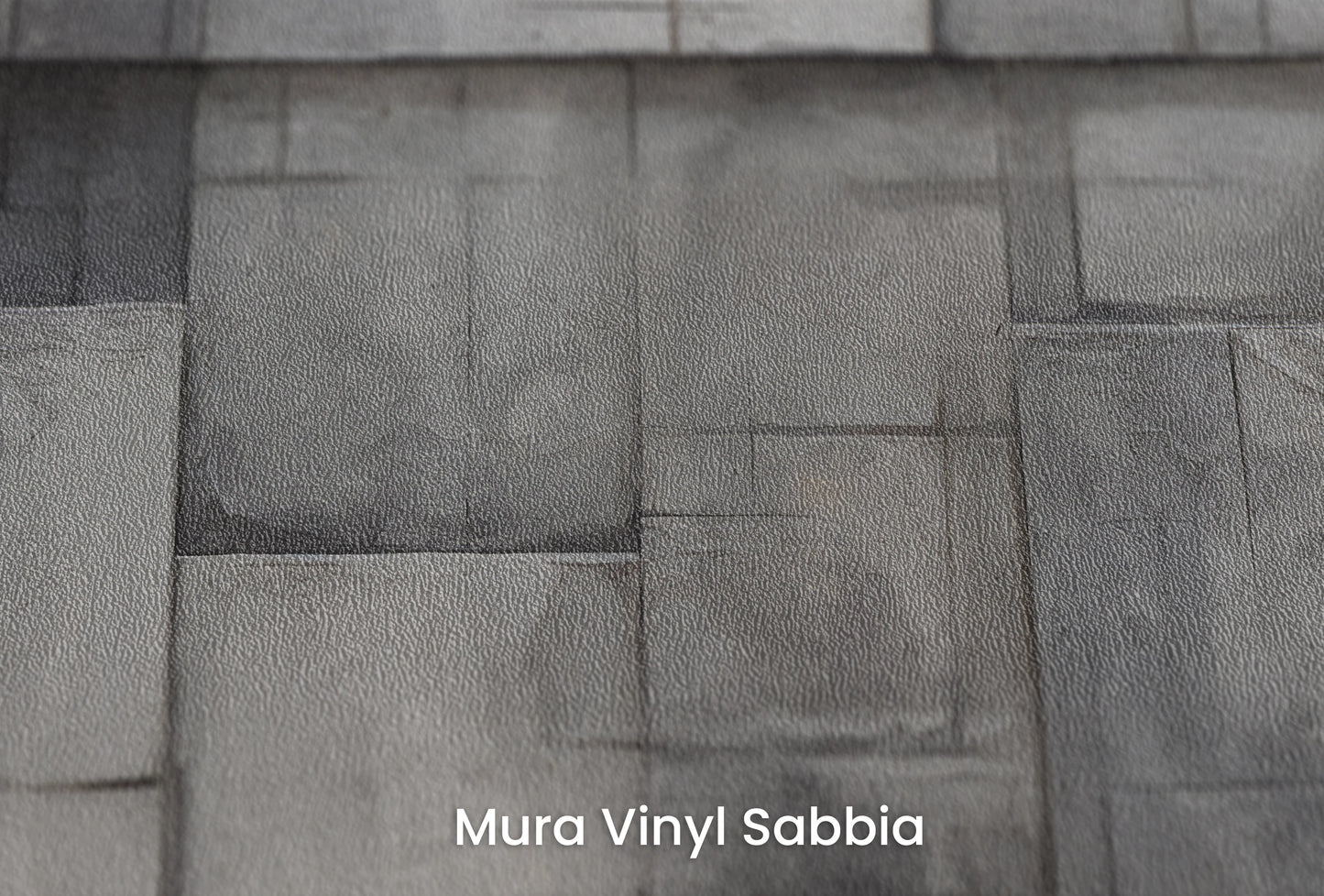 Zbliżenie na artystyczną fototapetę o nazwie Modern Bricks na podłożu Mura Vinyl Sabbia struktura grubego ziarna piasku.