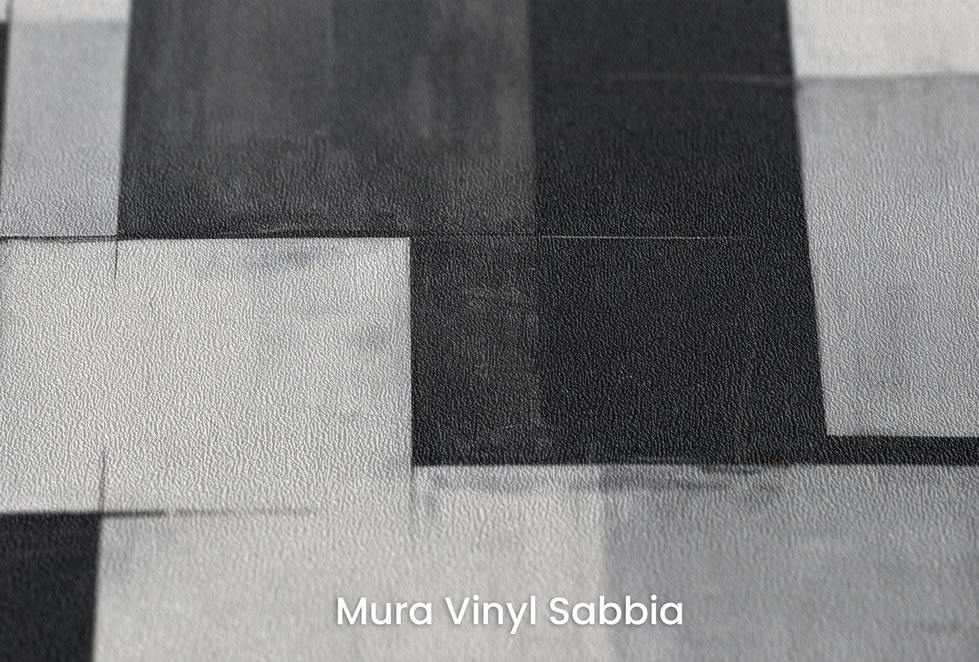 Zbliżenie na artystyczną fototapetę o nazwie Abstract Squares na podłożu Mura Vinyl Sabbia struktura grubego ziarna piasku.