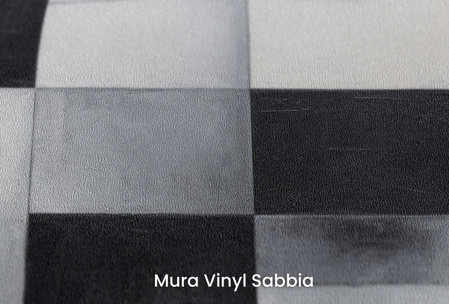 Zbliżenie na artystyczną fototapetę o nazwie Monochrome Crescent Intersection na podłożu Mura Vinyl Sabbia struktura grubego ziarna piasku.