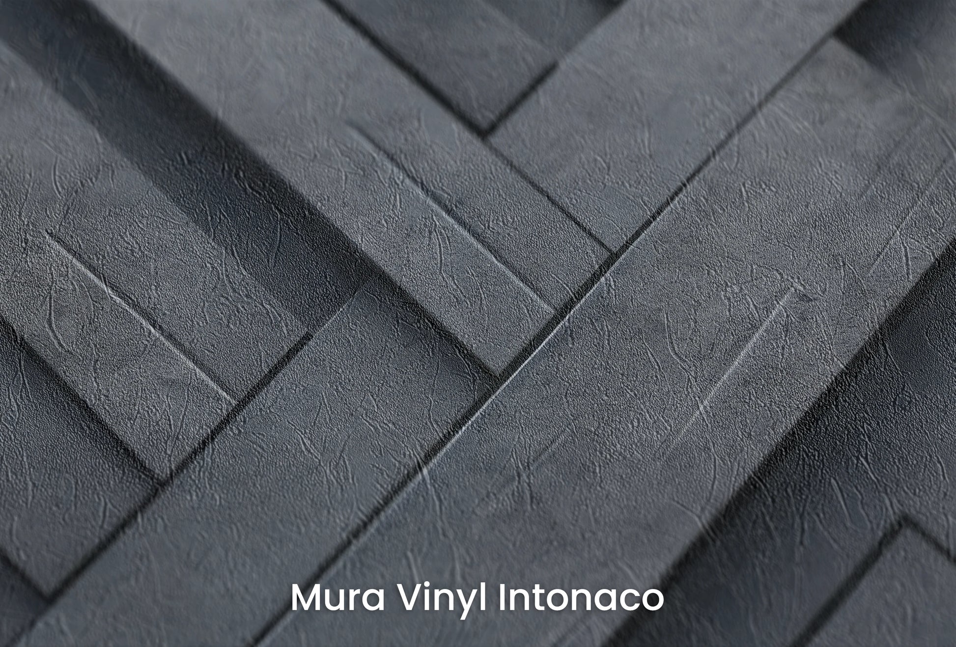 Zbliżenie na artystyczną fototapetę o nazwie Herringbone Illusion na podłożu Mura Vinyl Intonaco - struktura tartego tynku.
