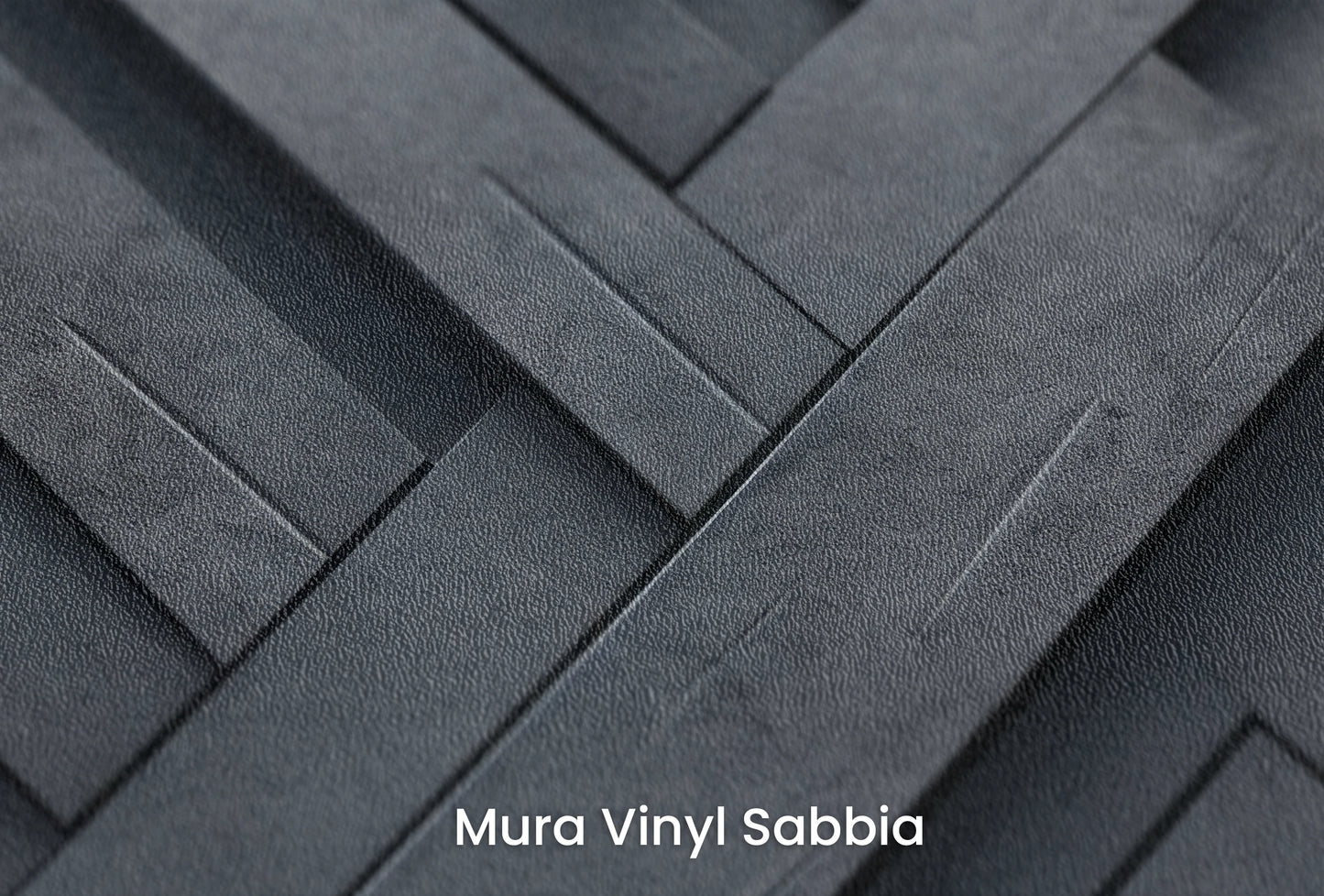 Zbliżenie na artystyczną fototapetę o nazwie Herringbone Illusion na podłożu Mura Vinyl Sabbia struktura grubego ziarna piasku.