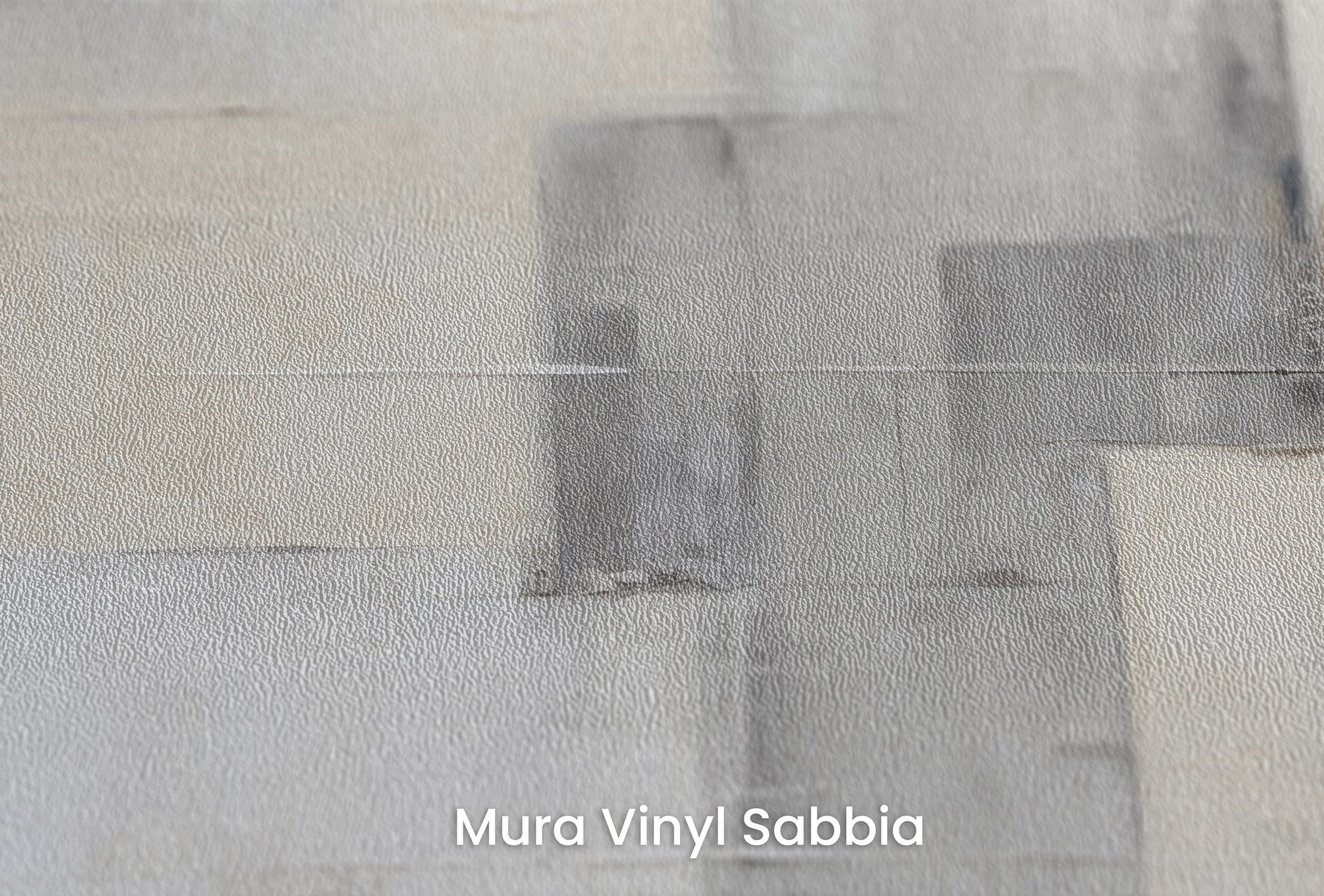 Zbliżenie na artystyczną fototapetę o nazwie Tonal Elegance na podłożu Mura Vinyl Sabbia struktura grubego ziarna piasku.