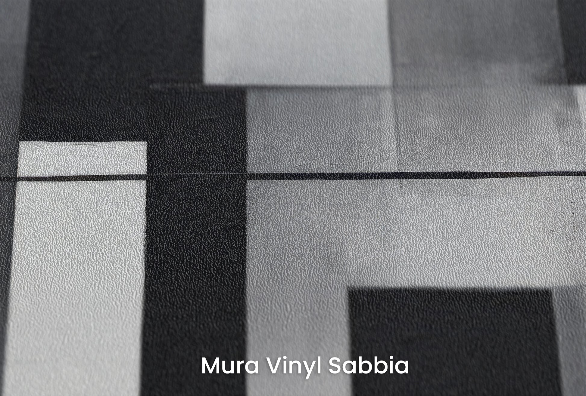 Zbliżenie na artystyczną fototapetę o nazwie Monochromatic Balance na podłożu Mura Vinyl Sabbia struktura grubego ziarna piasku.
