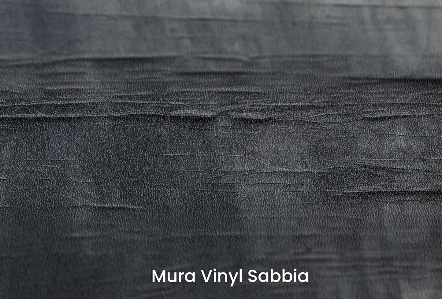 Zbliżenie na artystyczną fototapetę o nazwie Canvas Grayscale na podłożu Mura Vinyl Sabbia struktura grubego ziarna piasku.