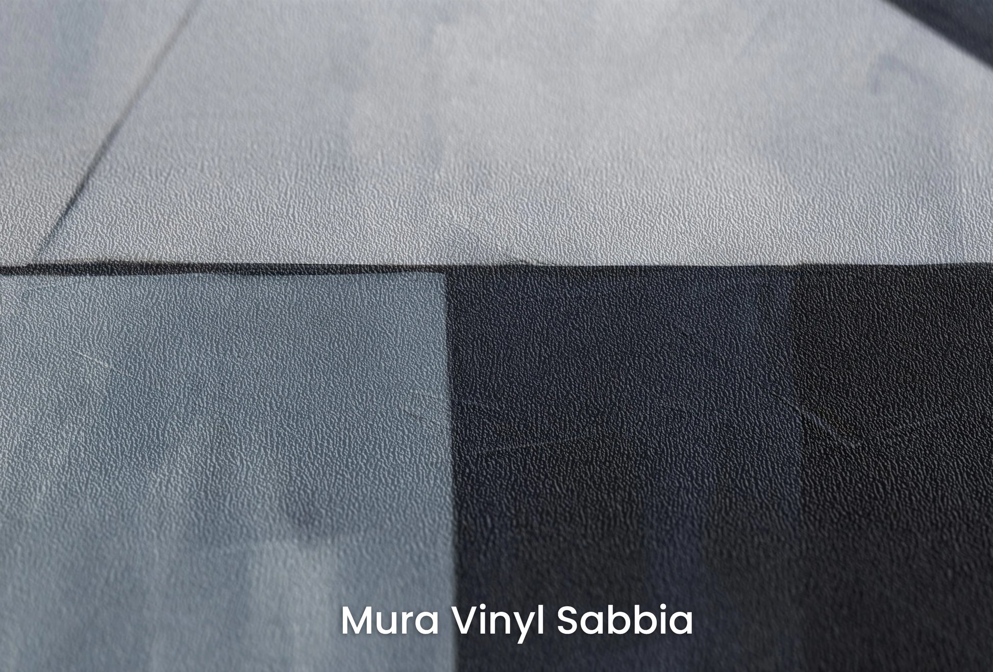 Zbliżenie na artystyczną fototapetę o nazwie Sharp Edges na podłożu Mura Vinyl Sabbia struktura grubego ziarna piasku.