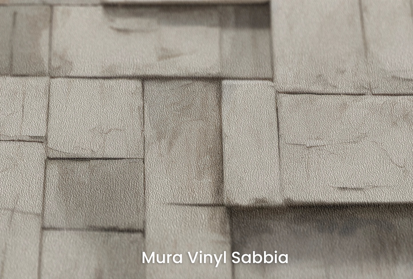 Zbliżenie na artystyczną fototapetę o nazwie Monochrome Mosaic na podłożu Mura Vinyl Sabbia struktura grubego ziarna piasku.