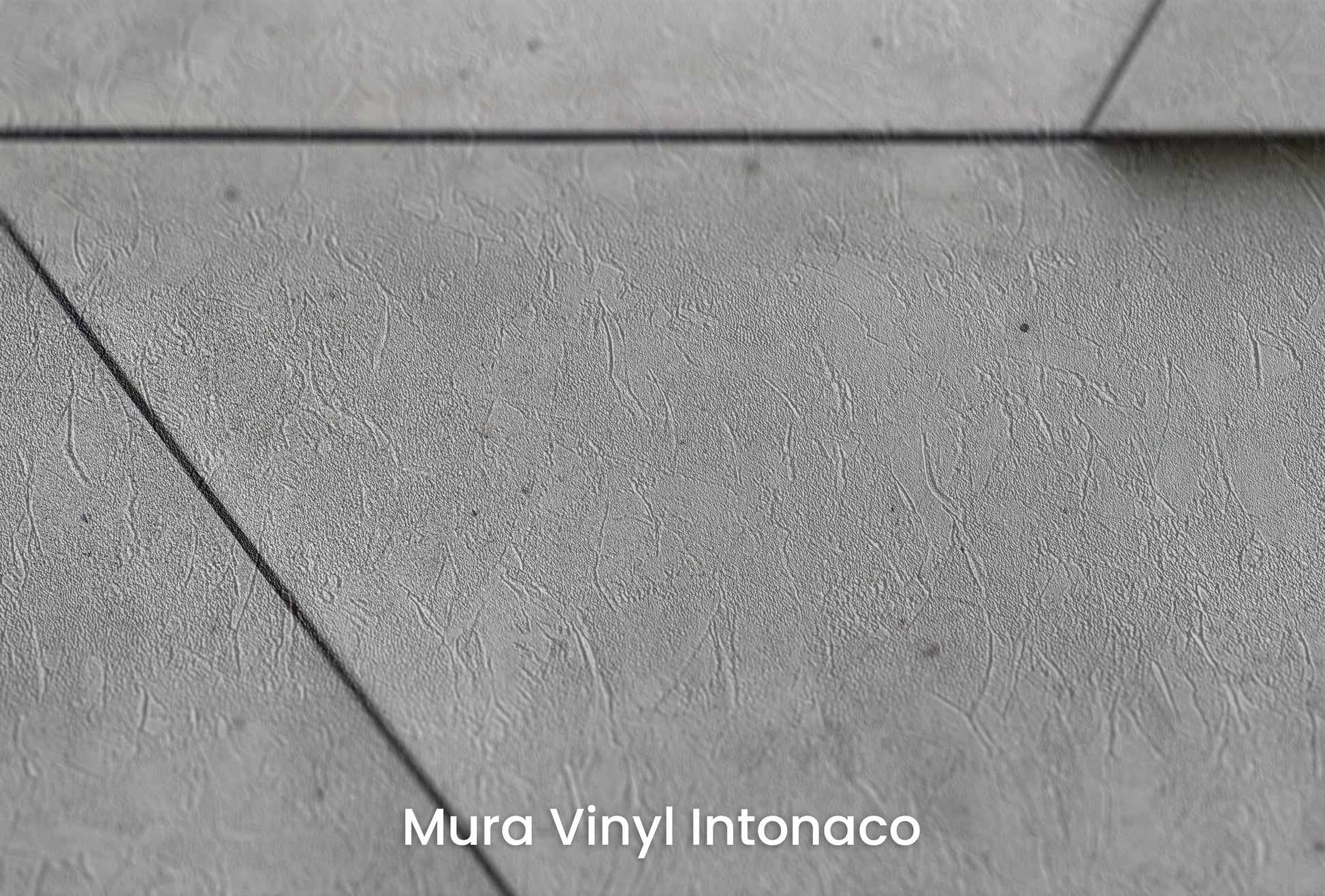 Zbliżenie na artystyczną fototapetę o nazwie Angular Mosaic na podłożu Mura Vinyl Intonaco - struktura tartego tynku.