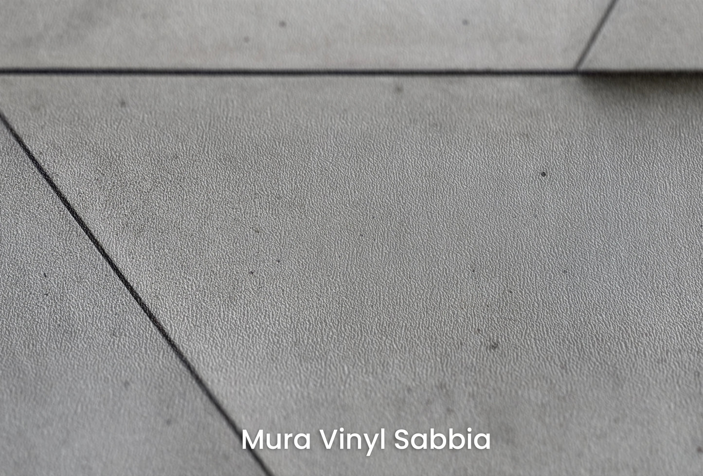 Zbliżenie na artystyczną fototapetę o nazwie Angular Mosaic na podłożu Mura Vinyl Sabbia struktura grubego ziarna piasku.