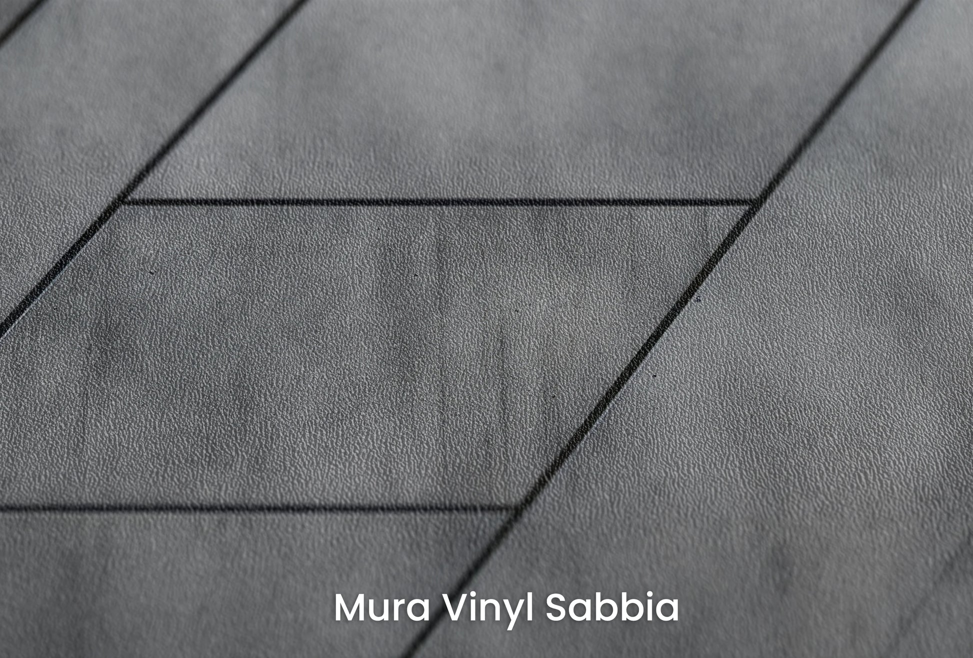 Zbliżenie na artystyczną fototapetę o nazwie Linear Perspective na podłożu Mura Vinyl Sabbia struktura grubego ziarna piasku.