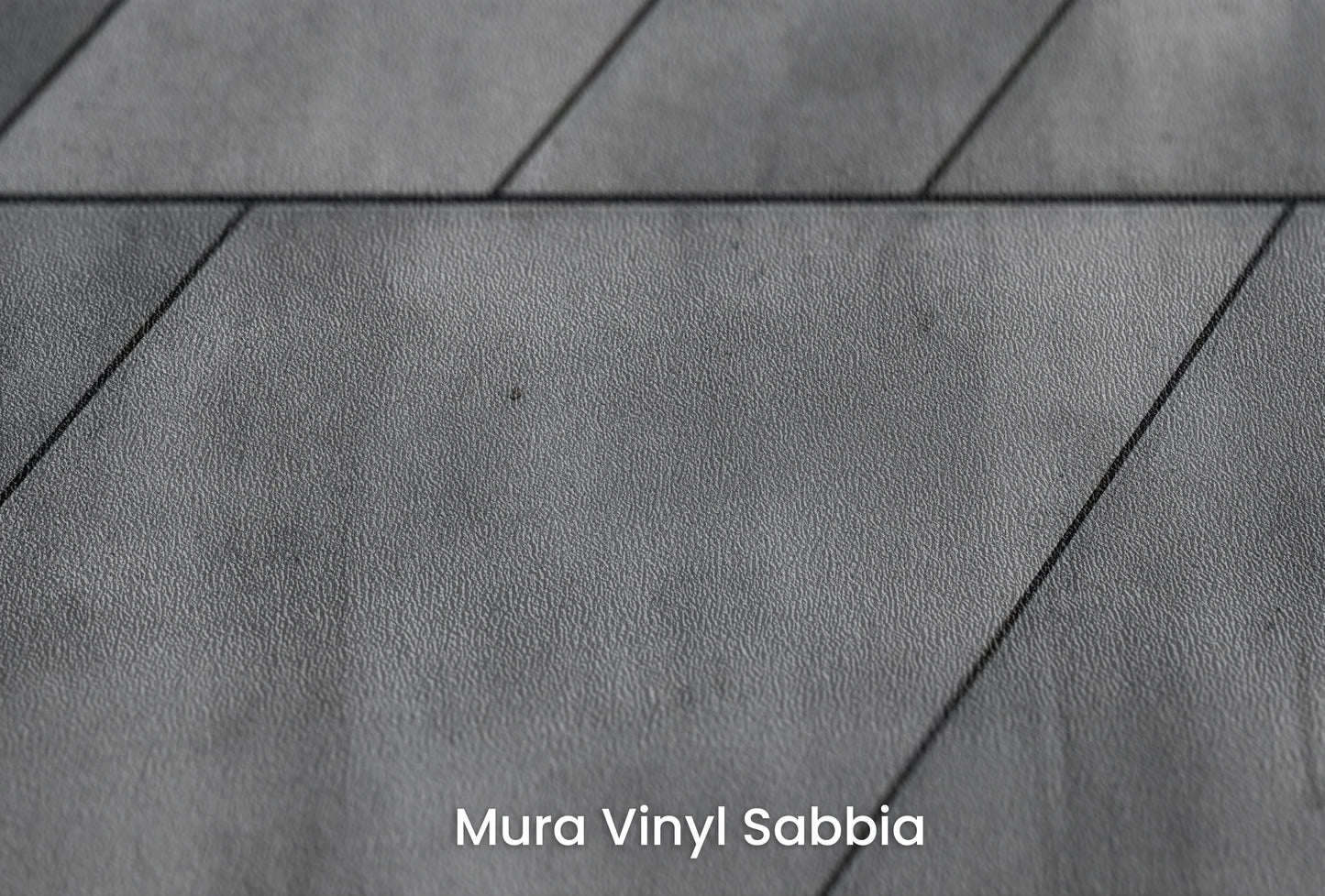 Zbliżenie na artystyczną fototapetę o nazwie Concrete Rays na podłożu Mura Vinyl Sabbia struktura grubego ziarna piasku.