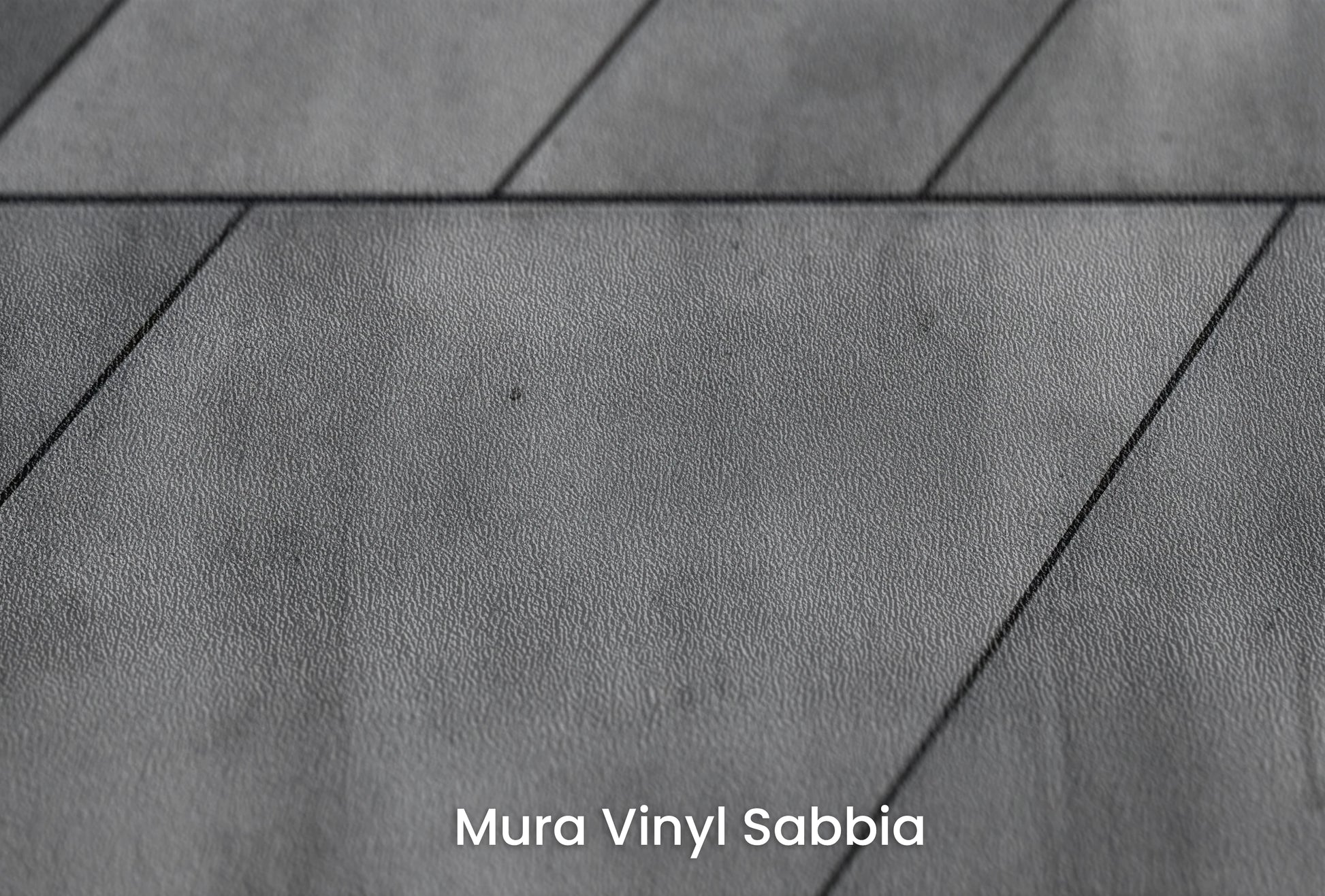 Zbliżenie na artystyczną fototapetę o nazwie Concrete Rays na podłożu Mura Vinyl Sabbia struktura grubego ziarna piasku.